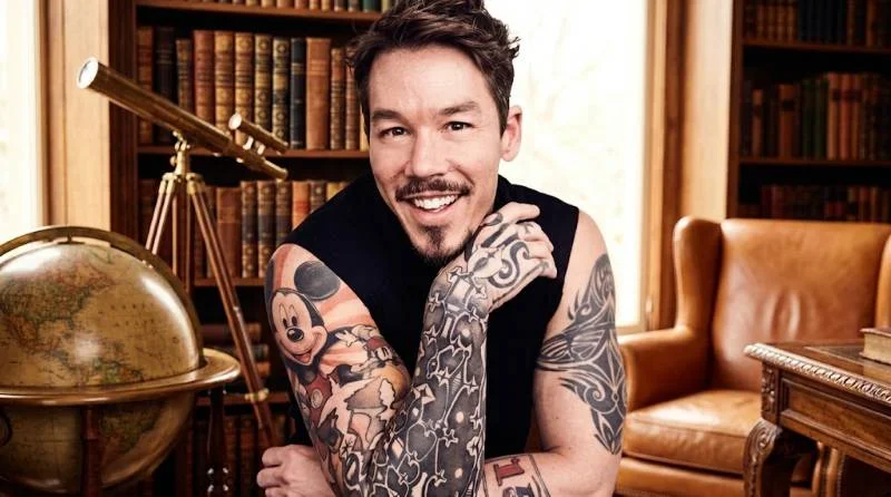 David Bromstad painting a bold mural in a design studio