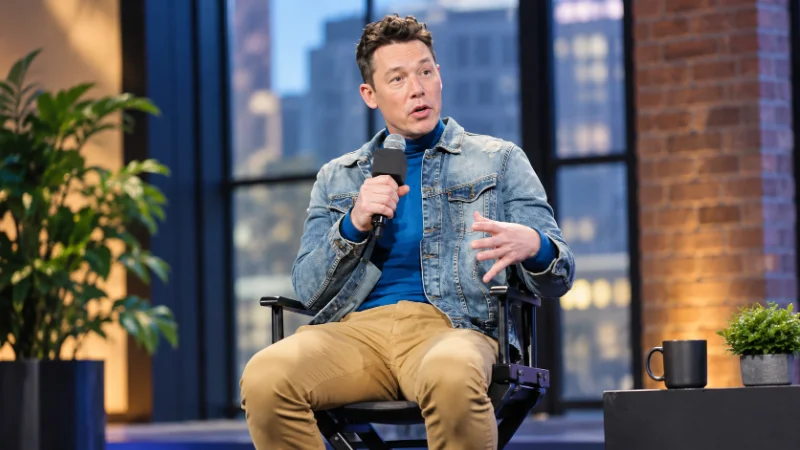David Bromstad touring a home with new owners while filming My Lottery Dream Home