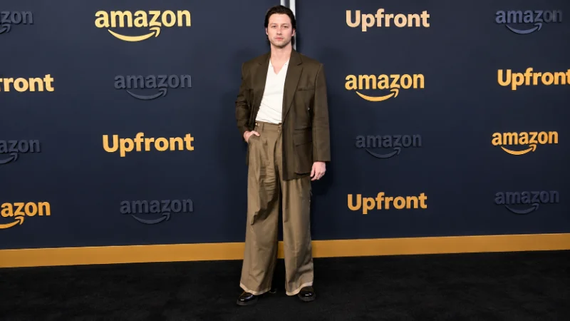 Stephen Kalyn in a suit at a premiere event