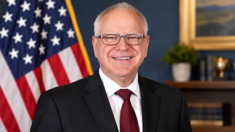 Tim Walz talking with residents at a community event in a small town